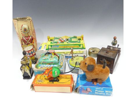 A Louis Marx &amp; Co. tinplate clockwork Mechanical Drummer Boy, boxed, together with six other various tinplate toys, inclu