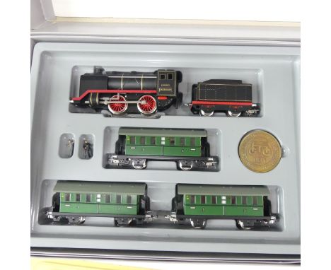 A Marklin HO gauge boxed double train set,&nbsp; Jubilee 50th anniversary '50 Jahre Marklin HO', comprising 0-4-0 tank loco a
