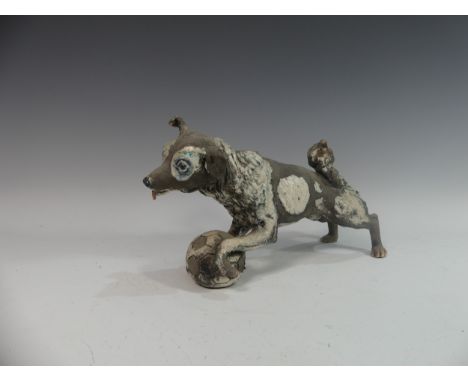 Lawson E. Rudge (b. 1936), a raku fired studio pottery sculpture of a Border Collie, modelled playing with a football, L 38cm