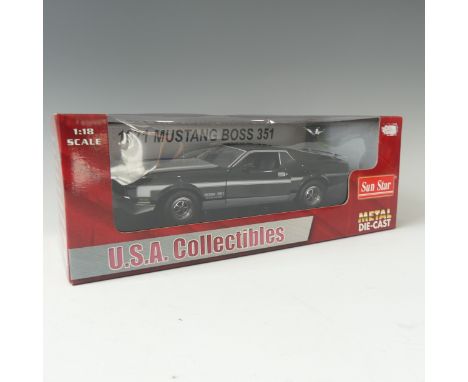 A 1971 1:18 scale model of a Boss Mustang 351 by Sun Star, black and silver, boxed. 