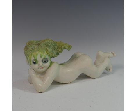 Lawson E. Rudge (b. 1936), a raku fired studio pottery sculpture of a Baby, modelled laying on her stomach, L 36cm. Provenanc