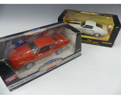 A 1968 1:18 scale model of a Mustang CJ428, white with black stripe, boxed, together with a 1969 Pontiac GTO Judge, boxed (2)