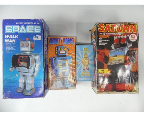 Four Vintage Boxed Robots, including a tinplate battery operated Space Walk Man ME 100, a boxed tinplate clockwork Japanese M