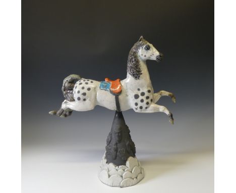 Lawson E. Rudge (b. 1936), a raku fired studio pottery sculpture of a Carousel Horse, numbered 5 on saddle cloth, raised on a