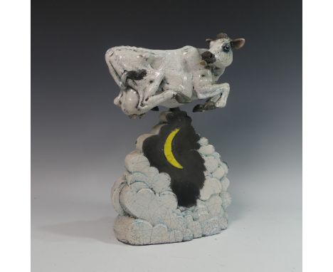 Lawson E. Rudge (b. 1936), a raku fired studio pottery sculpture 'the Cow jumped over the Moon', in two parts, with crackle g