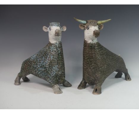 Lawson E. Rudge (b. 1936), a pair of raku fired studio pottery sculptures of Bulls, both with tails missing the other with ho