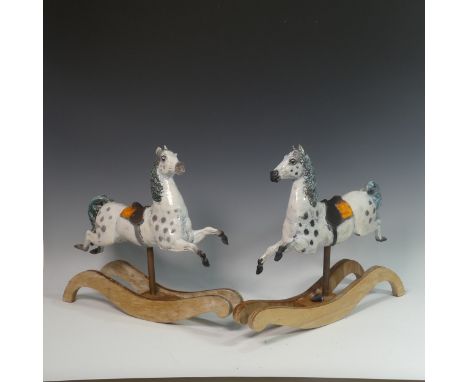 Lawson E. Rudge (b. 1936), a pair of raku fired studio pottery sculptures of Carousel Horses, one with chip to ear the other 