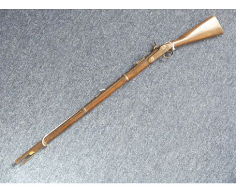 A British army PS3 rifle dated 1858,&nbsp;39 inch sighted barrel, the lock plate marked and dated 1858, wooden stock with bra