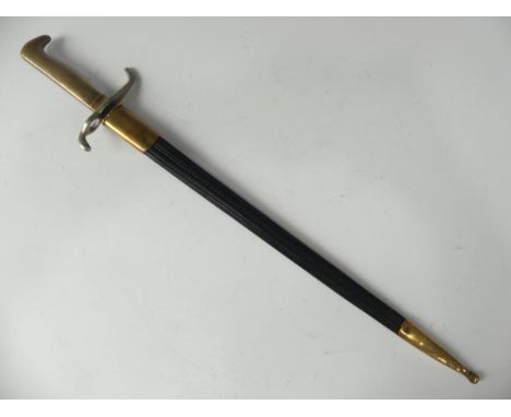 An 1871 Sawback Imperial German Bayonet, with brass and steel hilt, steel sawback blade with very faint etchings and makers m