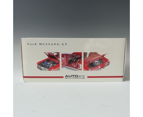 An Auto Art 1:18 scale model of a Ford Mustang GT, red with white stripe, boxed. 