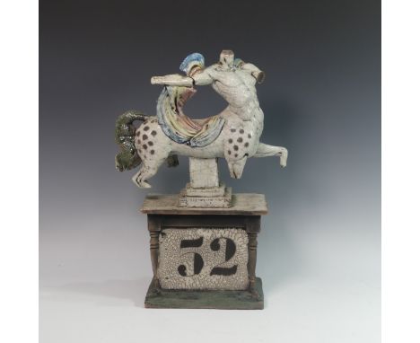 Lawson E. Rudge (b. 1936), a raku fired studio pottery sculpture Centaur on Pedestal Base, numbered 52, firing crack to arm a