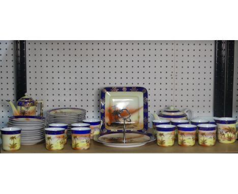 A Victoria China Czechoslovakian 'Desert Scene' pattern part Tea Service, comprising twelve Cups and eleven Saucers, Jug, Cof