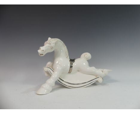 Lawson E. Rudge (b. 1936), a white glazed studio pottery sculpture Carousel Horse, hairline crack to base, L 40cm. Provenance