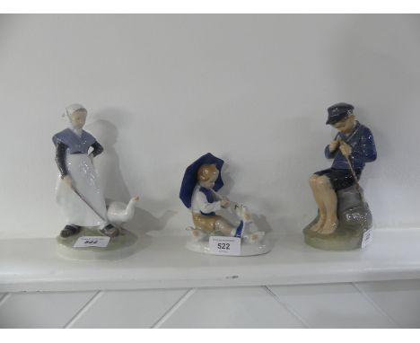 A Royal Copenhagen figure of a Boy Whittling a Stick, model no 905, together with another Royal Copenhagen figure of a Lady w