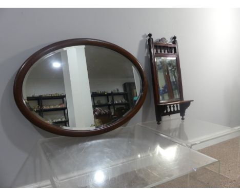 An Edwardian inlaid mahogany oval Wall Mirror, with bevelled glass plate, 83cm x 58cm, together with an Edwardian Wall Shelf,