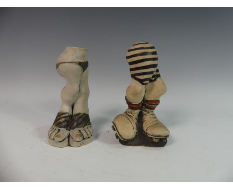 Lawson E. Rudge (b. 1936), a pair of studio pottery Salt and Pepper Pots, in the form of rugby boots and legs, H 19cm (2) Pro