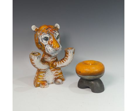 Lawson E. Rudge (b. 1936), a raku fired studio pottery sculptural Candlestick 'Burning Bright', modelled as a tiger with two 