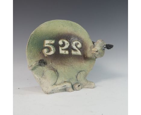 Lawson E. Rudge (b. 1936), a raku fired studio pottery sculpture of a round Cow, numbered 522, H 26cm. Provenance: from the s