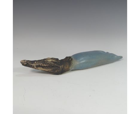 Lawson E. Rudge (b. 1936), a studio pottery sculpture of a Crocodile in a Toothpaste Tube, incised signature and dated 1974 t
