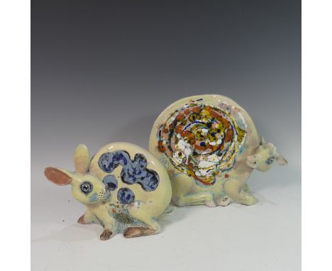 Lawson E. Rudge (b. 1936), a raku fired studio pottery sculpture of a round Cow, H 26cm, together with a round Hare similar (
