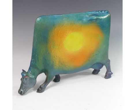 Lawson E. Rudge (b. 1936), a raku fired studio pottery sculpture of a Grazing Cow, with metallic finish to one side, and sun 