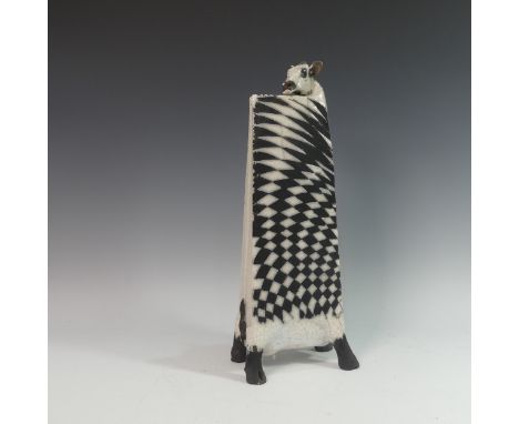 Lawson E. Rudge (b. 1936), a raku fired studio pottery sculpture of an elongated Cow, with chess board design, numbered 25, H