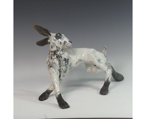 Lawson E. Rudge (b. 1936), a raku fired studio pottery sculpture of a Hare, with blue tinted glaze, L 49cm. Provenance: from 