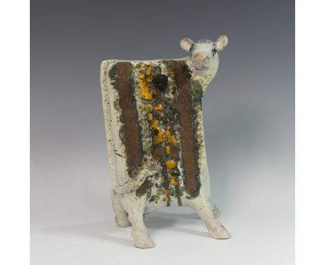 Lawson E. Rudge (b. 1936), a raku fired studio pottery sculpture of a Cow, numbered 525, H 34cm. Provenance: from the studio 