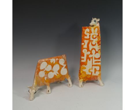 Lawson E. Rudge (b. 1936), a raku fired studio pottery sculpture of a elongated Cow, with orange abstract decoration, togethe