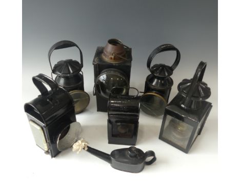Railwayana; six lamps and a lamp lighter, including SR/BR hand lamp, BR(S) signal interior, varying conditions (7) 