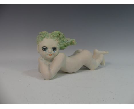 Lawson E. Rudge (b. 1936), a studio pottery sculpture of a Baby,&nbsp;modelled laying on her stomach, L 36cm. Provenance: fro