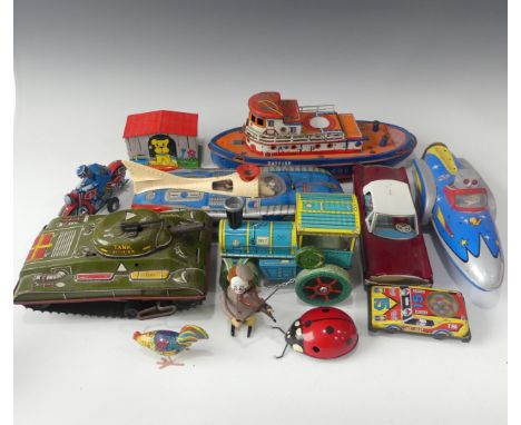 A collection of vintage tinplate toys, to include: a friction driven metalmania space patrol spaceship, a Hungarian battery p