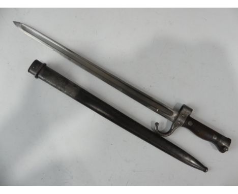 A WWI French sword Bayonet, for French M1892 Berthier Rifle, blade length 40cm, impressed number on quillon 47443, wood and s