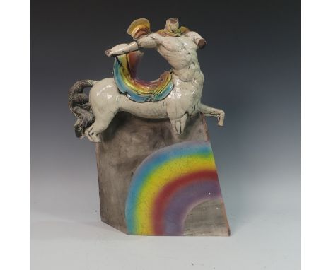 Lawson E. Rudge (b. 1936), a raku fired studio pottery sculpture of a Centaur, with rainbow design, firing crack to arm and n