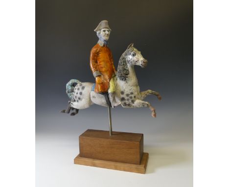 Lawson E. Rudge (b. 1936), a raku fired studio pottery sculpture of George Stubbs, modelled riding a horse, raised on a plint