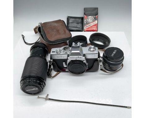 Camera lot includes Minolta SRT201 with carrying case, Rokkor-X 50mm lens with lens caps, Minolta zoom lens 75-200mm with len