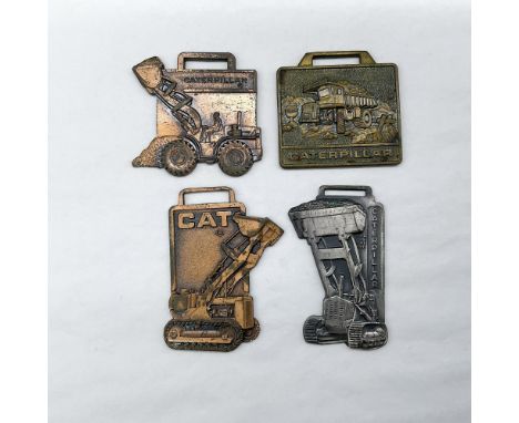 Metal finish with embossed design and lettering. First fob front side: Caterpillar; reverse side: Compliments of Arthur J. Go