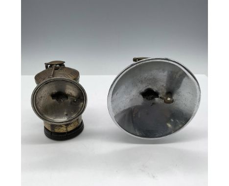 Two versions of lighting offered to miners - wide lamp with hook clip on (4"L x 4.25"W x 5"H) and small brass clip on with na