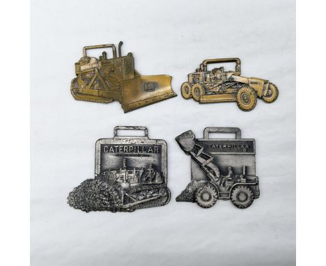 Metal finish with embossed design and lettering. First fob front view: shaped as a bulldozer with the John Deere logo on the 