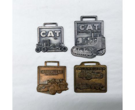 Metal finish with embossed design and lettering. First fob front side: CAT; reverse side: Michigan Tractor &amp; Mach. Co. - 