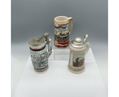 Compelling assortment of handled drink receptacles decorated with elaborate train designs. Largest item measures 6"L x 4"W x 