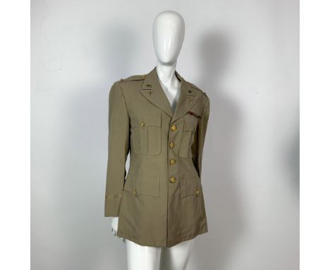 Tan wool jacket with US Army Air Forces patch on the shoulder. Also has military buttons, pins, and ribbon bar. Chest measure