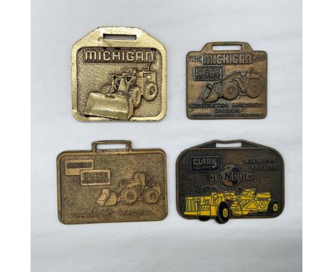 Metal finish with embossed design and lettering. First fob front side: Michigan; reverse side: blank. Second fob front side: 