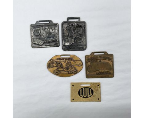 Metal finish with embossed design and lettering. First fob front side: Eimco with a bulldozer; reverse side: blank. Second fo