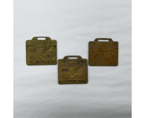 Metal finish with embossed design and lettering. 3 Construction Machinery Division - Benton Harbor, Michigan. First fob front
