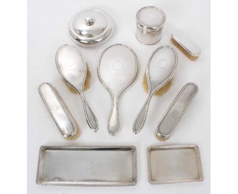 George V silver dressing table set, with engine turned decoration, comprising two pairs of hair brushes, hand mirror, lidded 