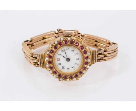 Early 20th century ladies' 15ct gold wristwatch with white enamel dial with Roman numerals and blued steel hands, the case se