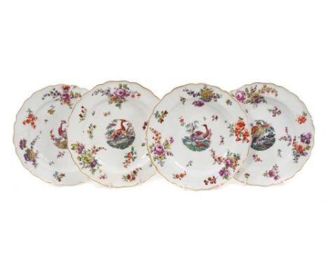 A good set of four 18th century Chelsea plates, each polychrome painted with central exotic bird roundels, surrounded by flor