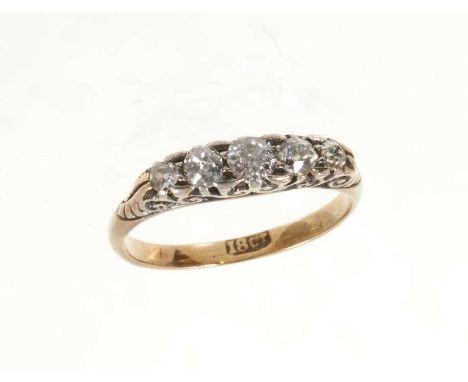 Late Victorian diamond five stone ring with five graduated old cut diamonds in carved gold setting on 18ct gold shank, estima