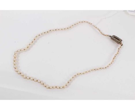 Cultured pearl necklace with a single strand of graduating pearls and a Georgian yellow metal seed pearl clasp, 45cm long
